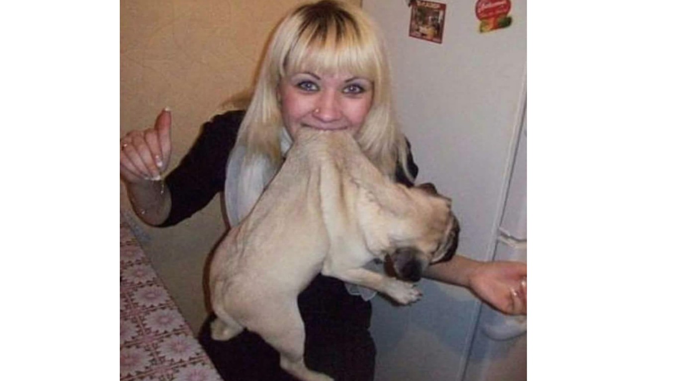 Arrest woman that put pet dog in her mouth and posed for photos!